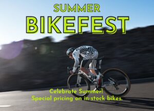 Man riding bike in the mountains. Banner text that says Summer Bikefest